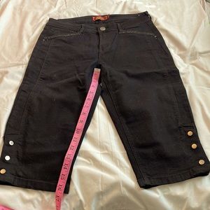 Black denim capris the 16 inch inseam, detailing on the legs